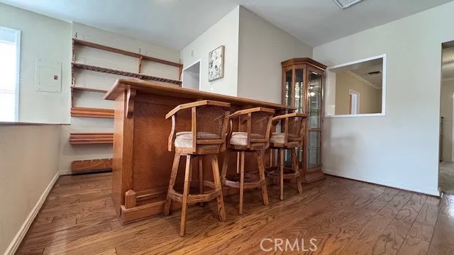 a view of wooden chairs in a room