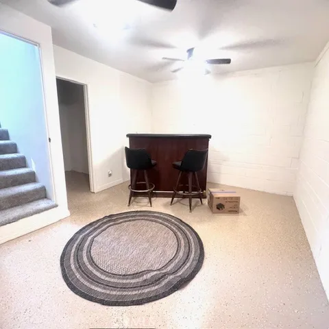 a living room with furniture and a rug