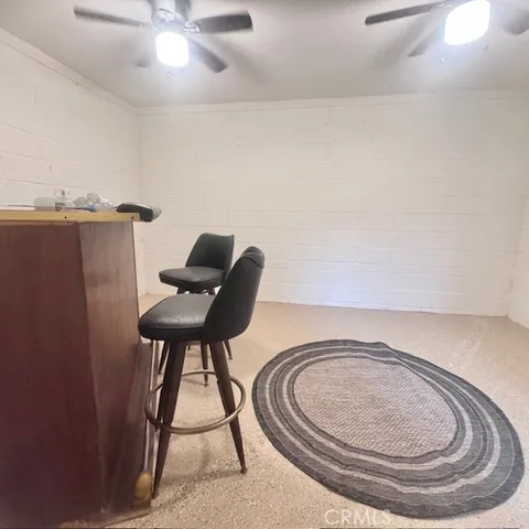 a bathroom with a toilet and a mirror