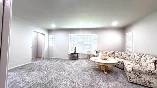 a living room with furniture and window