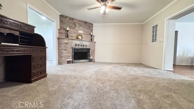 a view of empty room with a fireplace