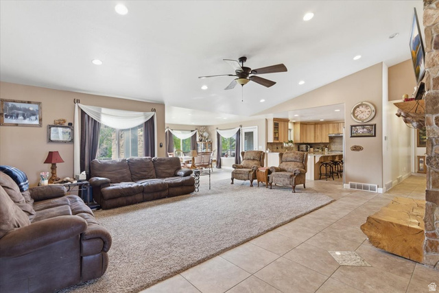 6237 West 4600th Street South Hooper, UT 84315 - Photo 7 of 48 Living area featuring ceiling fan, healthy amount of natural light, vaulted ceiling, recessed lighting, and light tile patterned floors