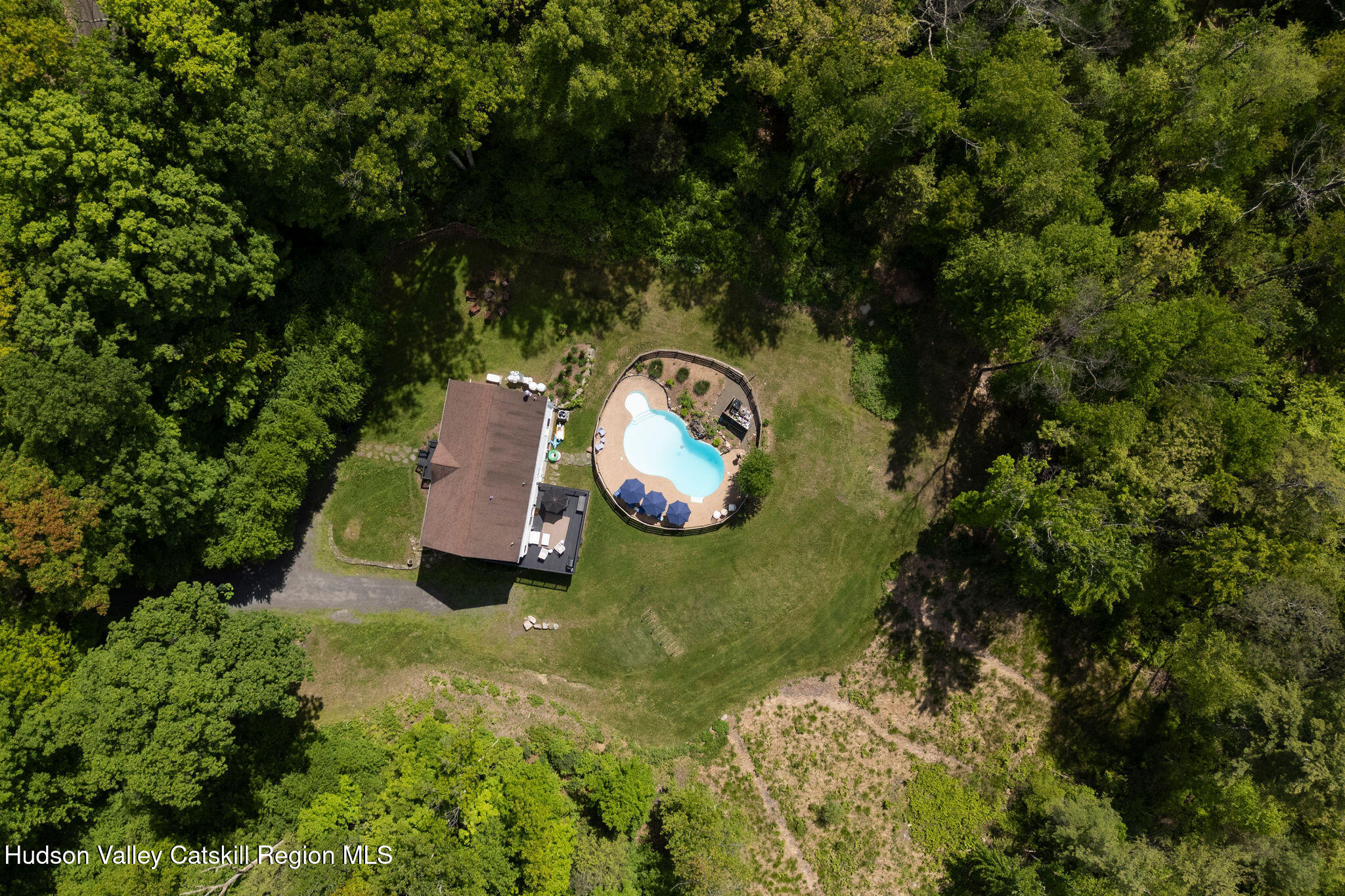 31 Laurel Hollow Road Kerhonkson, NY 12446 - Photo 37 of 47 an aerial view of a house with a yard swimming pool and tennis court