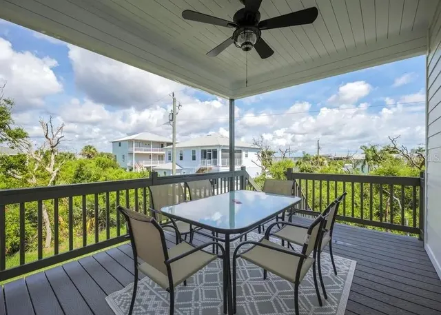 a view of a balcony with furniture