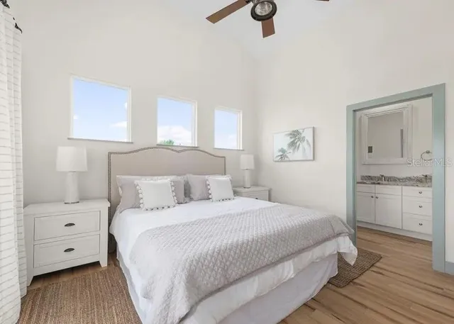 a bedroom with a bed and a window