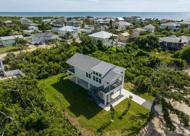 an aerial view of a house with a garden