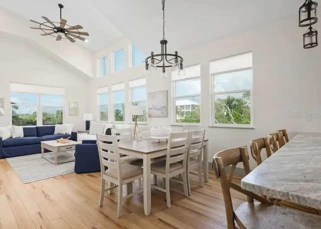 a view of a dining room with furniture window and outside view