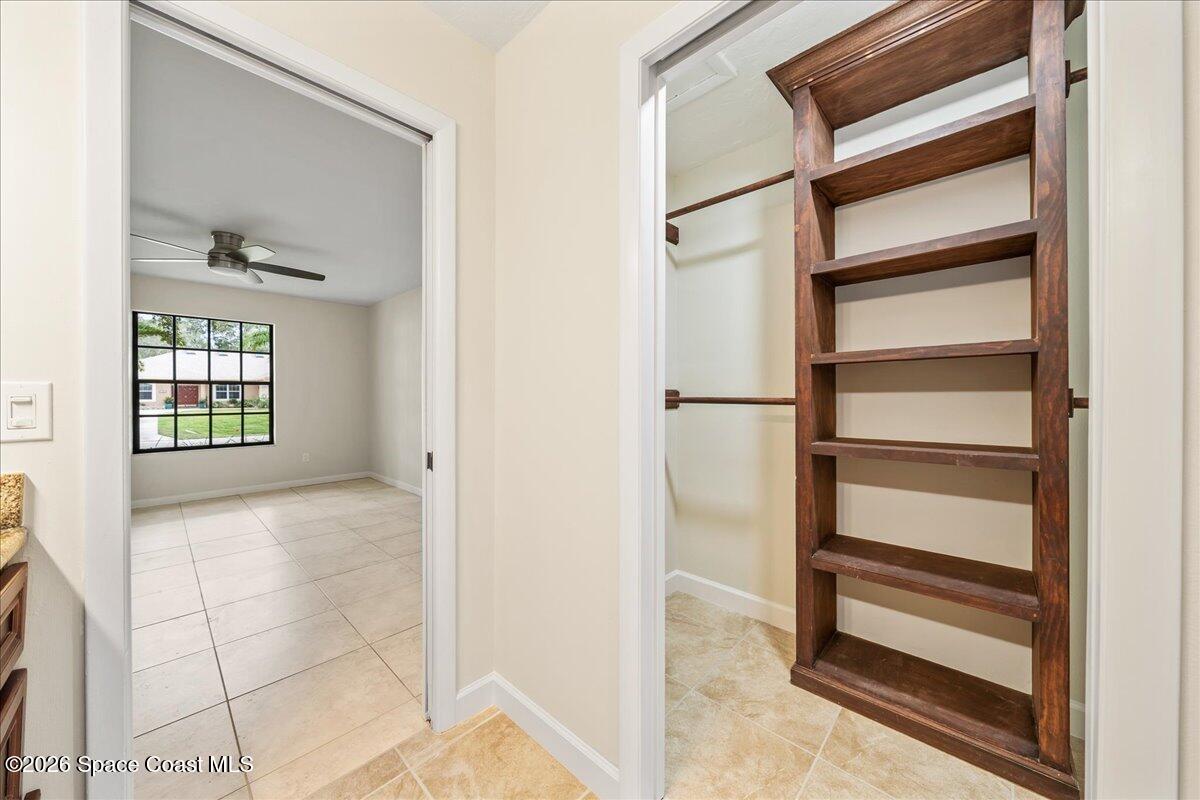 189 Abeto Terrace Sebastian, FL 32958 - Photo 19 of 38 a view of walk in closet with empty racks