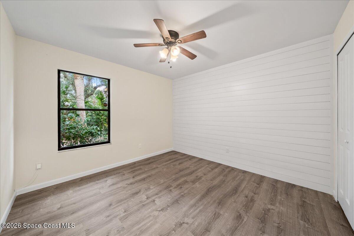 189 Abeto Terrace Sebastian, FL 32958 - Photo 21 of 38 wooden floor in an empty room with a window