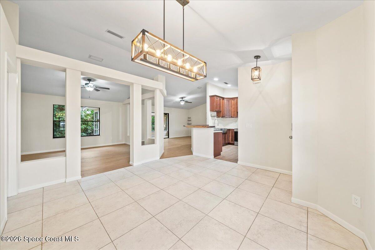 189 Abeto Terrace Sebastian, FL 32958 - Photo 8 of 38 a view of a kitchen with a sink and refrigerator