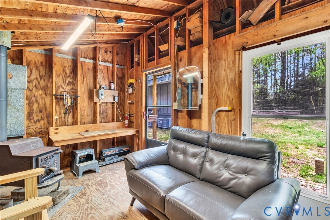 193 Deep Water Lane Reedville, VA 22539 - Photo 33 of 84 a living room with furniture and a large window