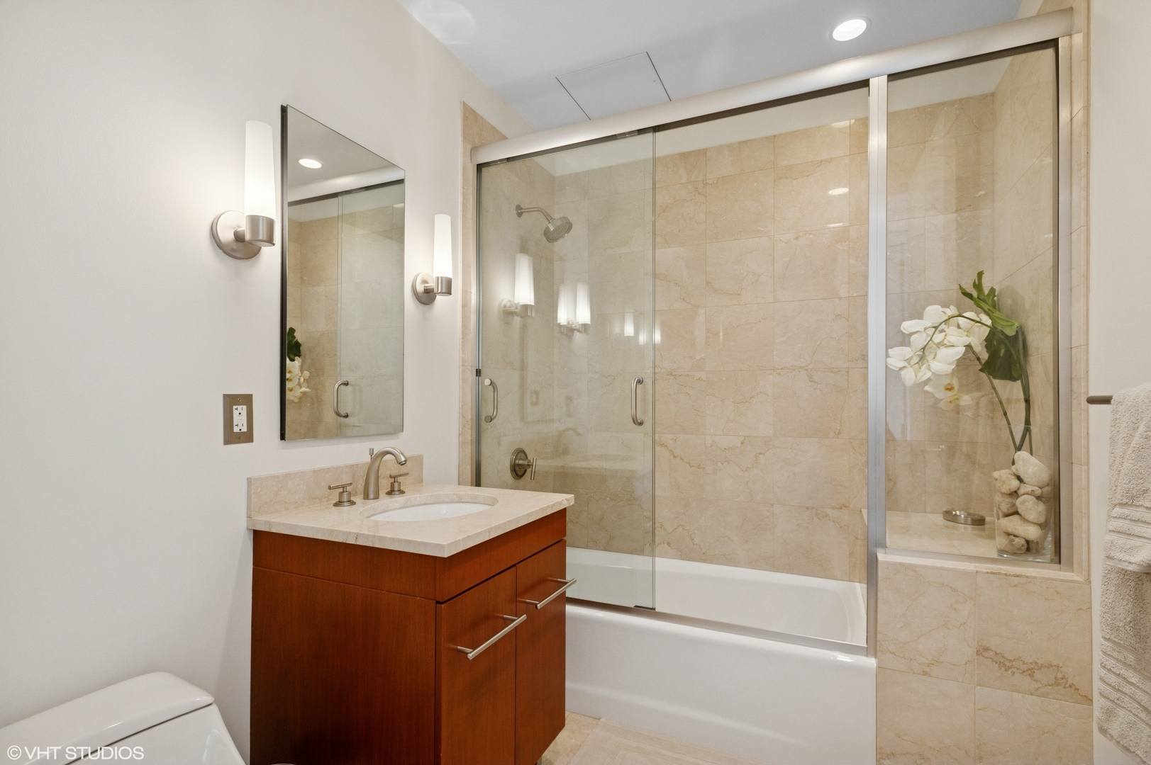 401 North Wabash Avenue, Unit 44F Chicago, IL 60611 - Photo 16 of 26 a bathroom with a shower sink vanity and mirror