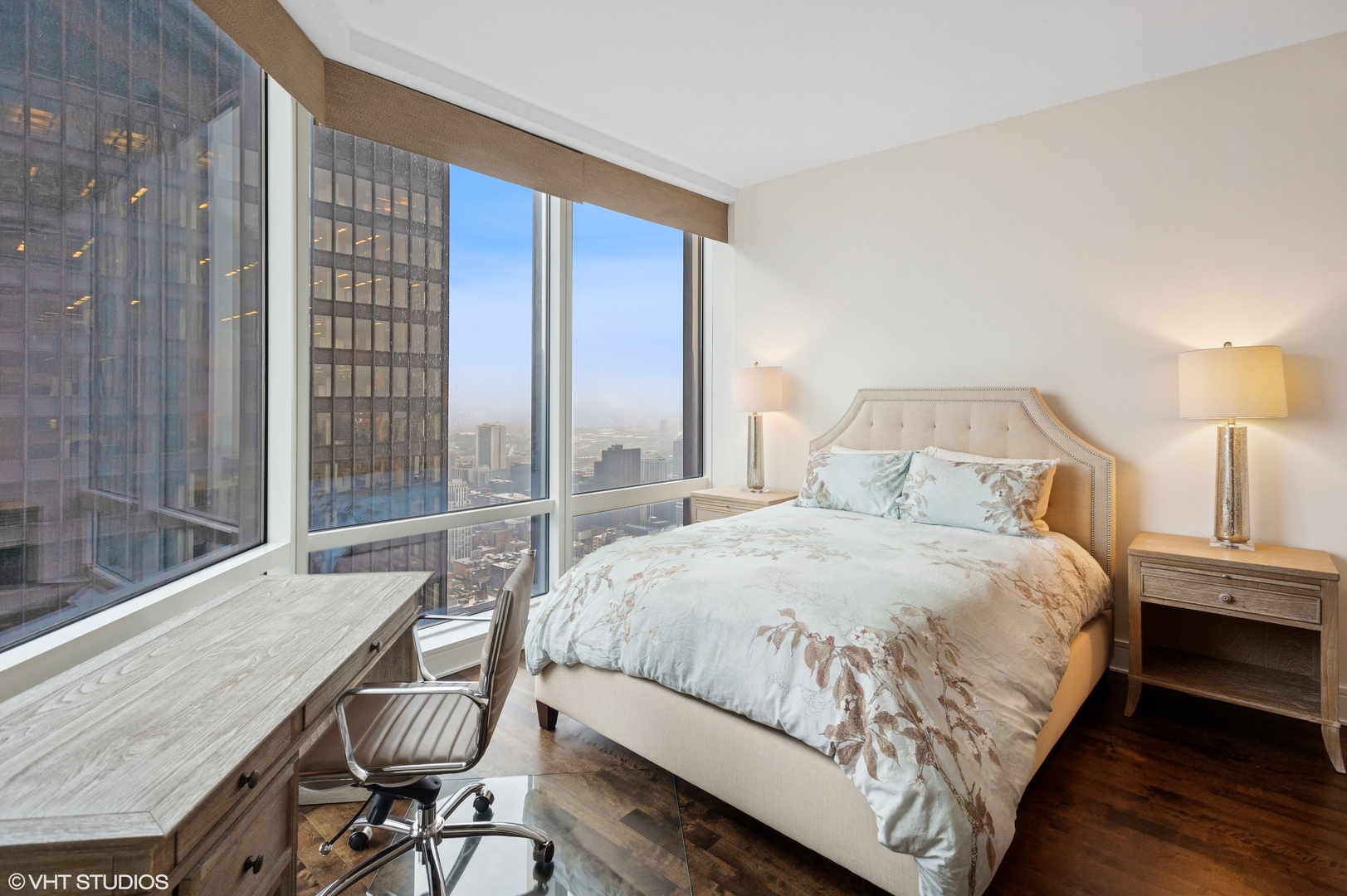 401 North Wabash Avenue, Unit 44F Chicago, IL 60611 - Photo 17 of 26 a bedroom with a bed a table and chair