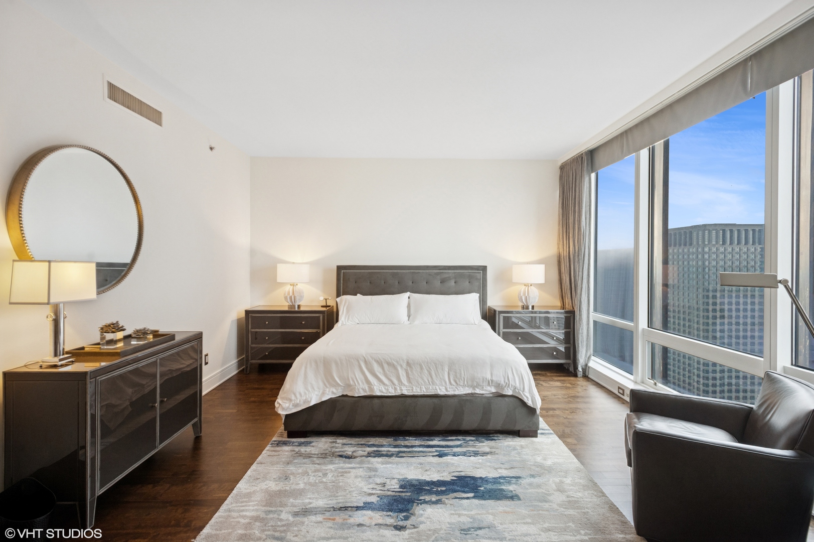 401 North Wabash Avenue, Unit 44F Chicago, IL 60611 - Photo 18 of 26 a bed room with a bed and a couch