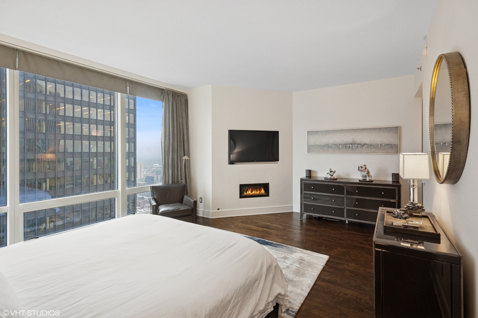 401 North Wabash Avenue, Unit 44F Chicago, IL 60611 - Photo 19 of 26 a bedroom with a bed and a flat screen tv