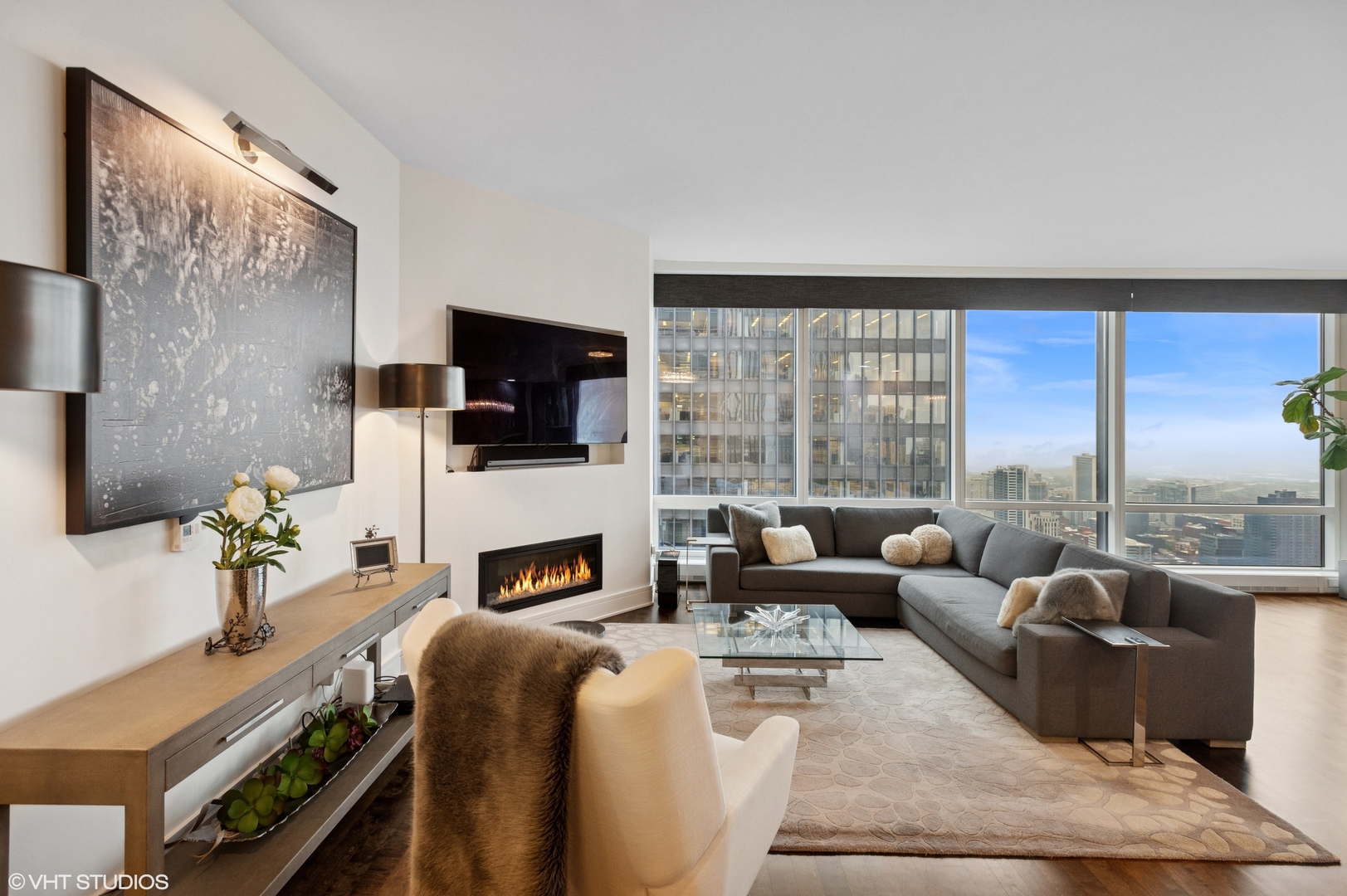 401 North Wabash Avenue, Unit 44F Chicago, IL 60611 - Photo 7 of 26 a living room with furniture fireplace and a flat screen tv