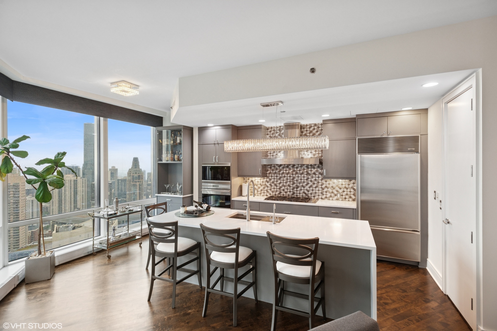 401 North Wabash Avenue, Unit 44F Chicago, IL 60611 - Photo 9 of 26 a dining hall with stainless steel appliances kitchen island granite countertop a dining table chairs and view living room