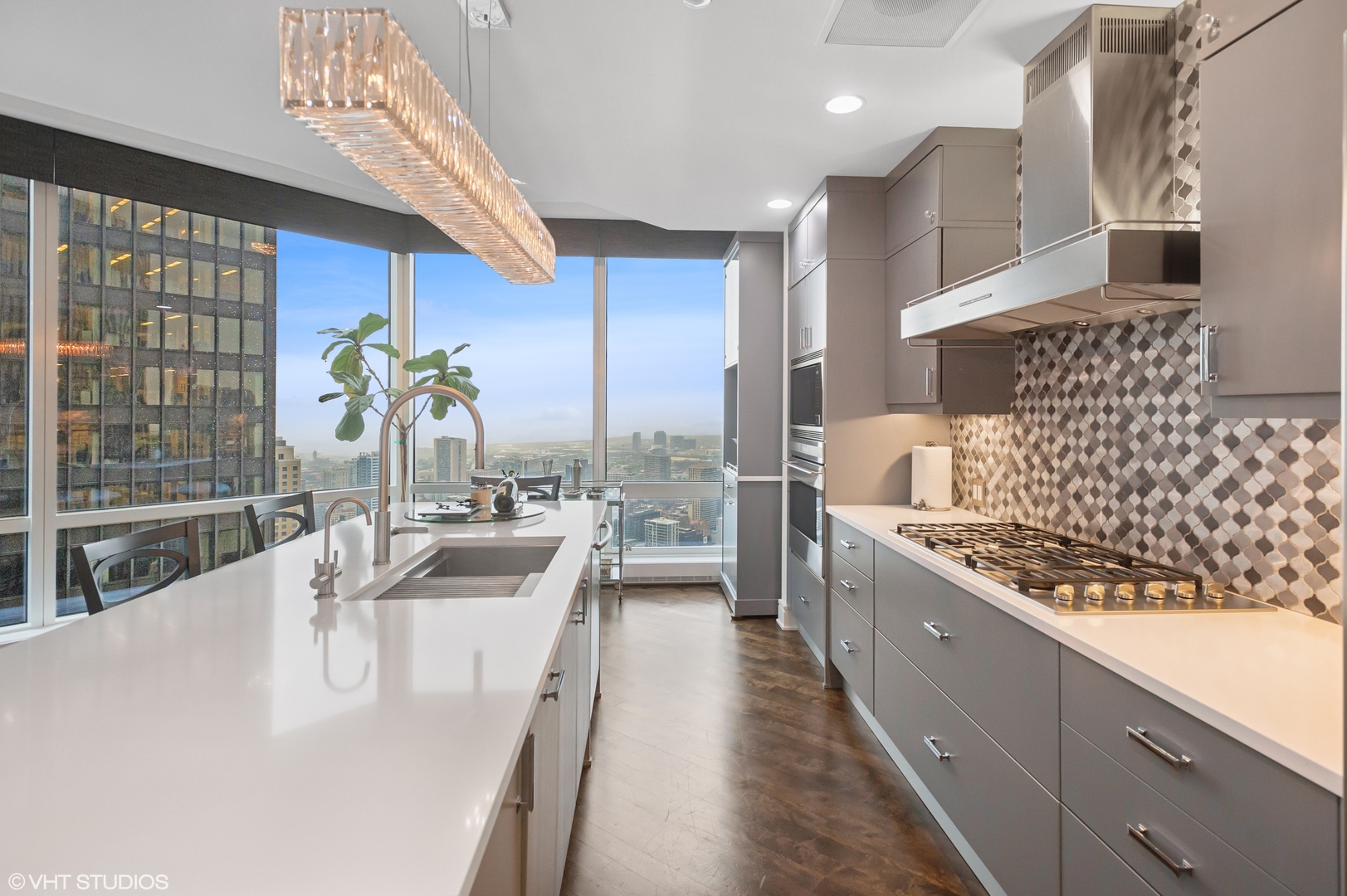 401 North Wabash Avenue, Unit 44F Chicago, IL 60611 - Photo 10 of 26 a kitchen with stainless steel appliances kitchen island granite countertop a large stove a sink and a refrigerator