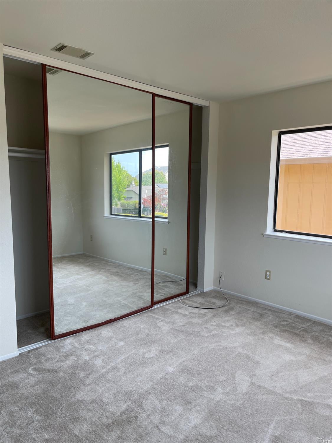 431 Darley Drive Vallejo, CA 94591 - Photo 21 of 27 an empty room with windows and closet
