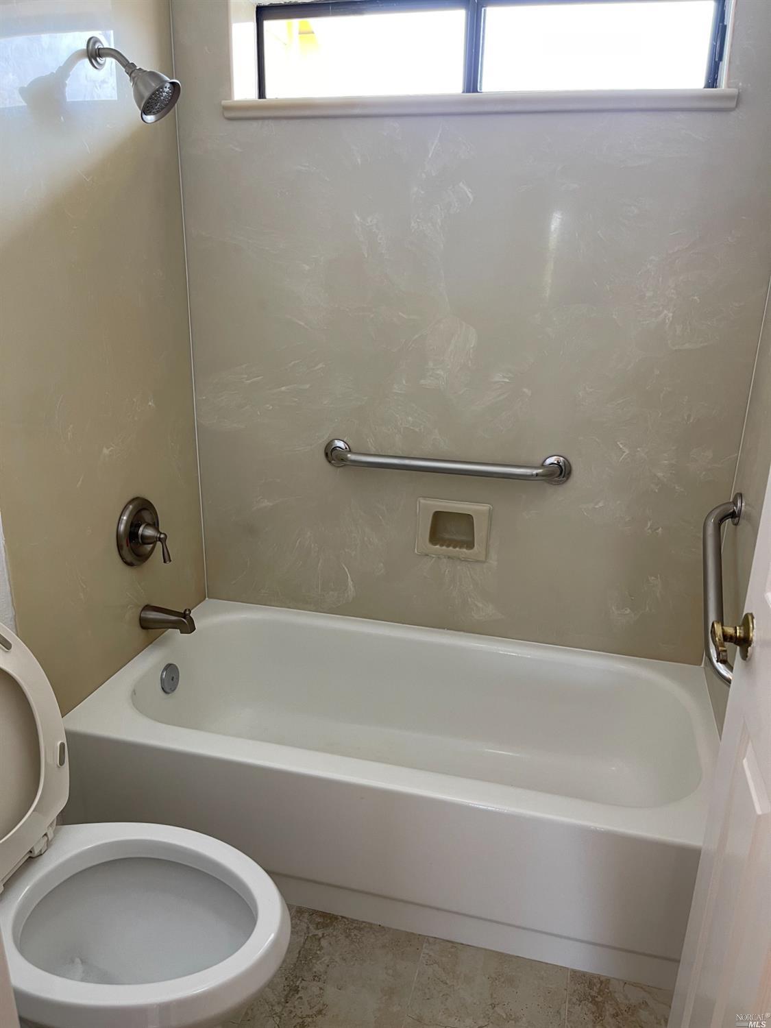 431 Darley Drive Vallejo, CA 94591 - Photo 24 of 27 a bathroom with a toilet and bathtub