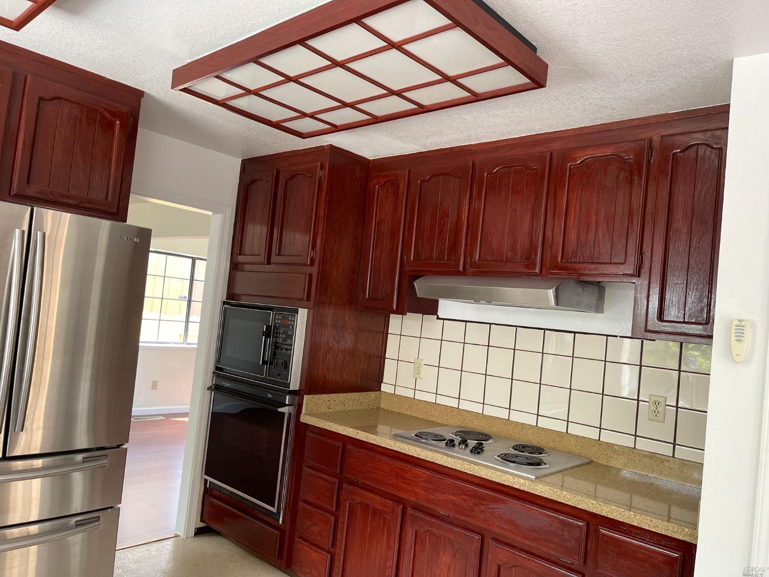 431 Darley Drive Vallejo, CA 94591 - Photo 9 of 27 a kitchen with stainless steel appliances granite countertop a refrigerator and a stove