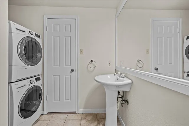 a bathroom with a sink a mirror and a window