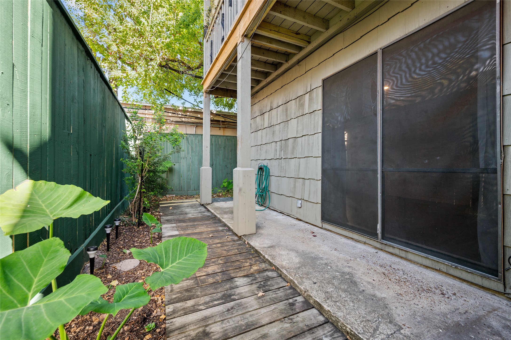 5718 Val Verde Street, Unit 7 Houston, TX 77057 - Photo 14 of 23 a path view of a house with a backyard