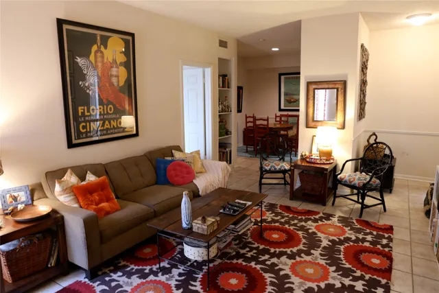 a dining room with furniture and wooden floor