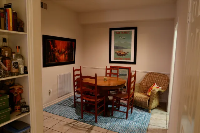 a living room with furniture a rug and a window