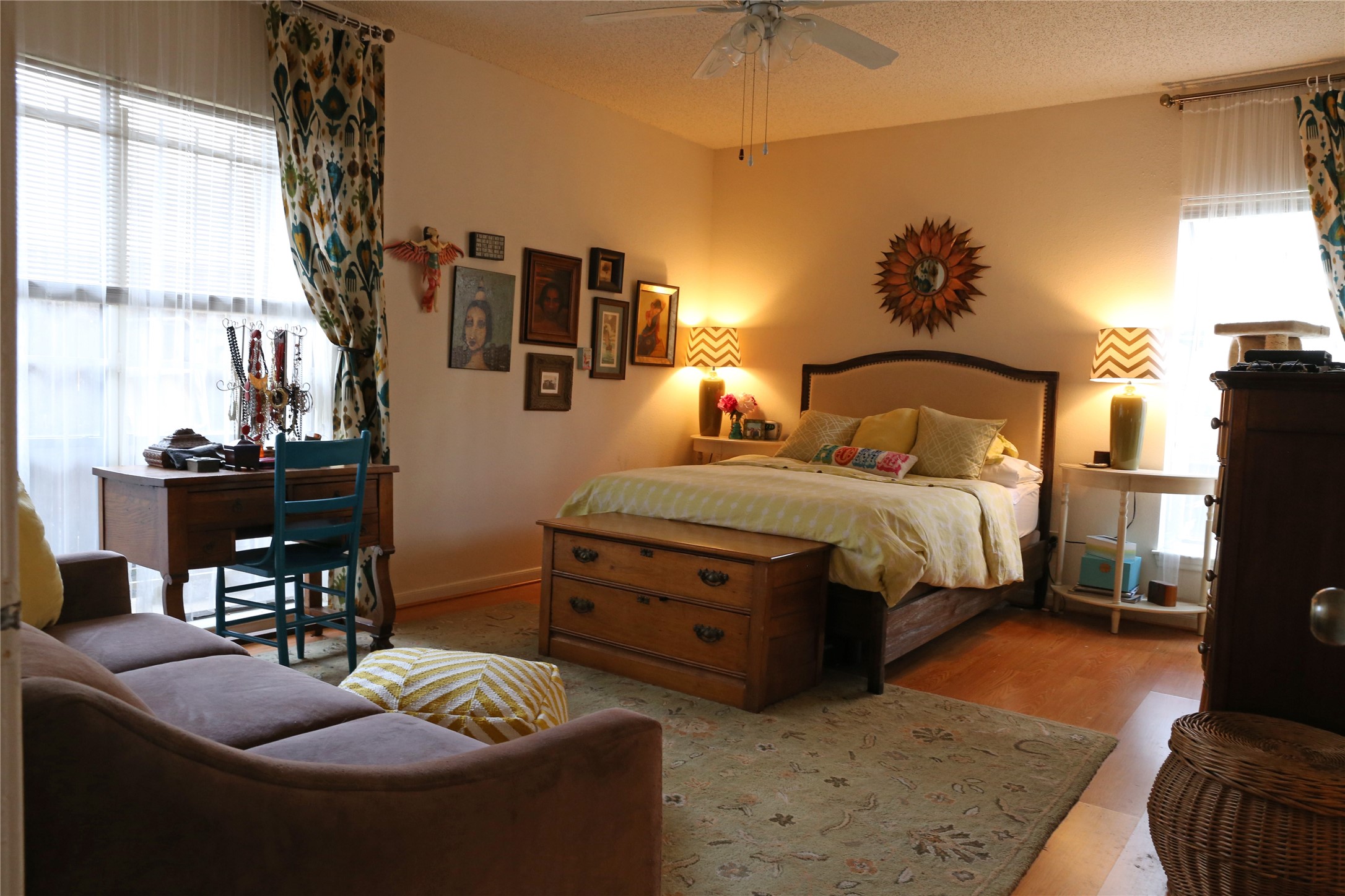 5718 Val Verde Street, Unit 7 Houston, TX 77057 - Photo 20 of 23 a bedroom with a bed and a chandelier