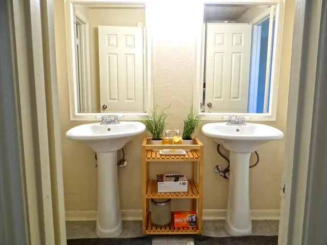 a bathroom with a sink and a mirror