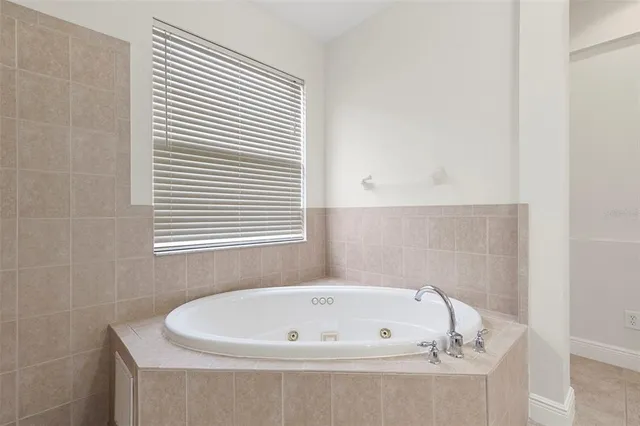 a view of a dining room with furniture and windows