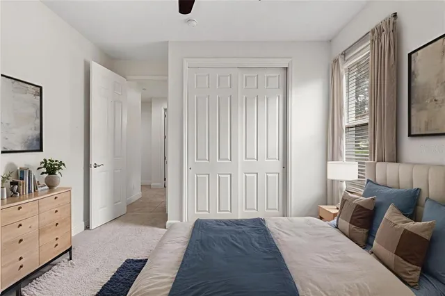 an aerial view of a house with a garden and lake view