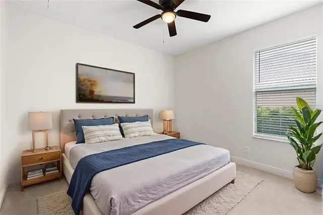 an aerial view of a house with a garden and trees all around