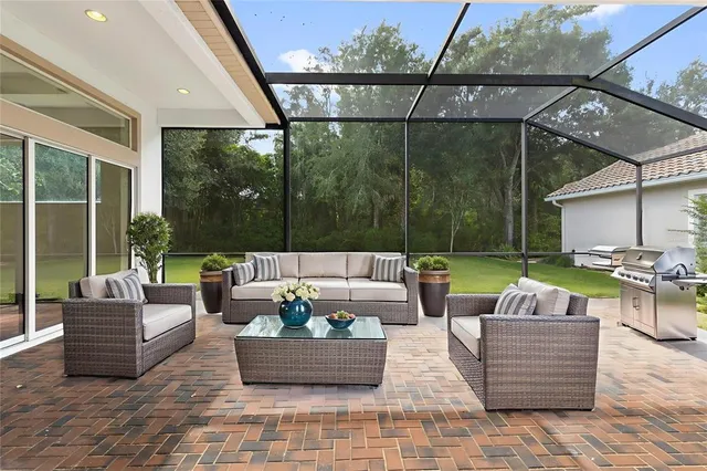 an aerial view of a house with outdoor space