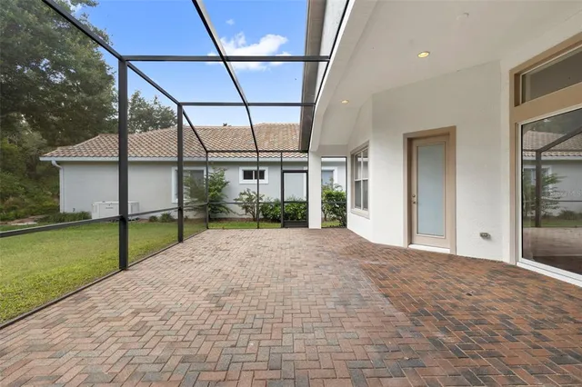 an aerial view of a house with outdoor space and lake view