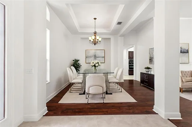 a view of a hallway with wooden floor and closet