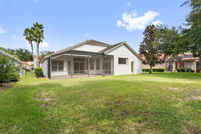 a living room with furniture a chandelier and a chandelier