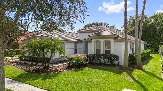 a living room with furniture and large windows