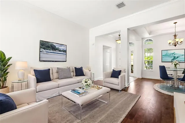 a bedroom with a large bed and a flat screen tv