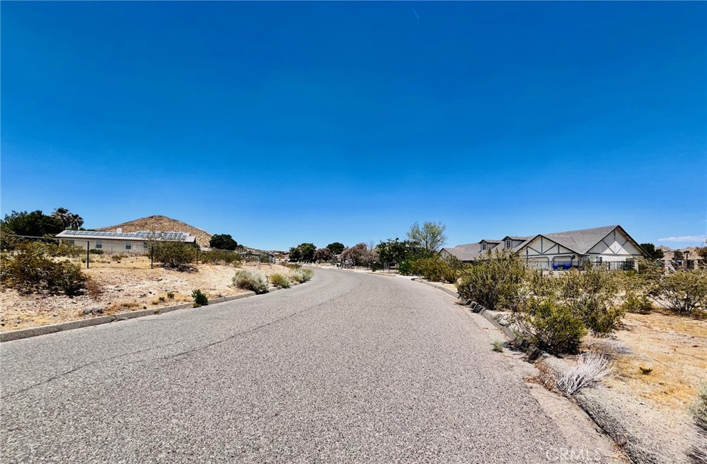 47333203 Muni Road Apple Valley, CA 92307 - Photo 16 of 21 a view of a road with a building in the background