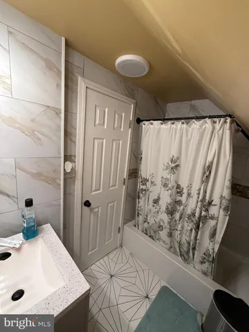 a bathroom with a sink and a shower