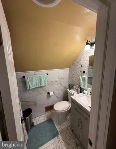 a bathroom with a sink and toilet