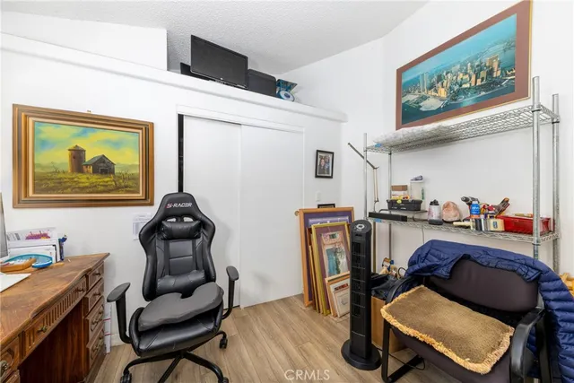 a work room with furniture and wooden floor