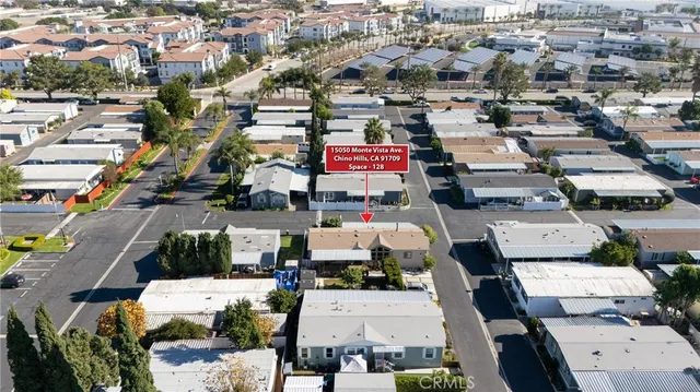 an aerial view of residential house with outdoor space and parking