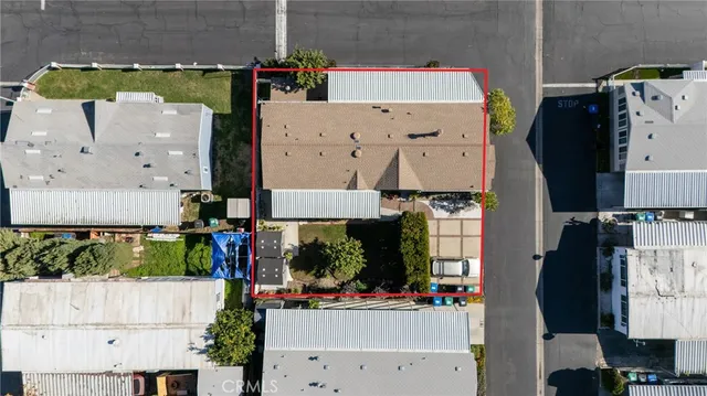 an aerial view of multiple houses with outdoor space