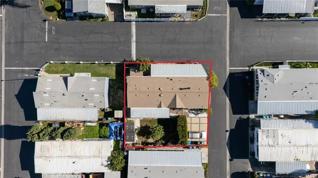 an aerial view of a house with outdoor space