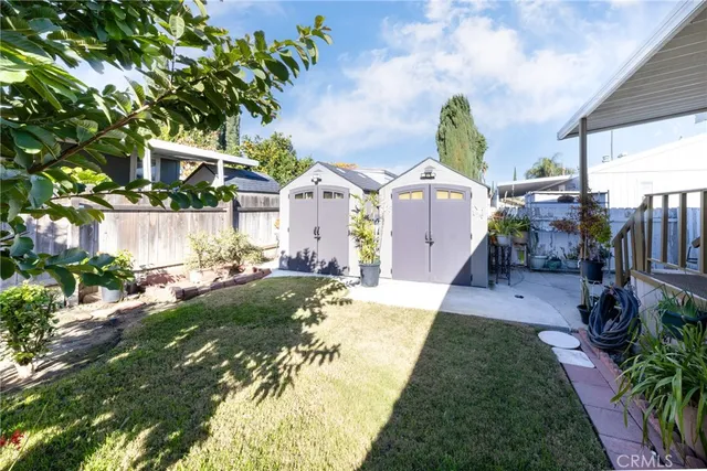 a front view of a house with a garden and plants