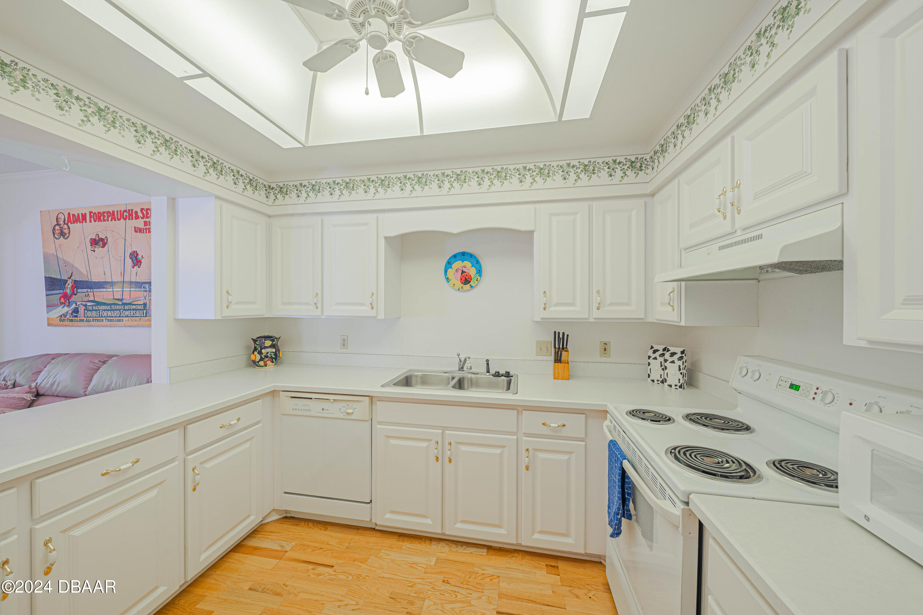 42 Jana Drive Ponce Inlet, FL 32127 - Photo 6 of 34 a kitchen with a sink a refrigerator and cabinets