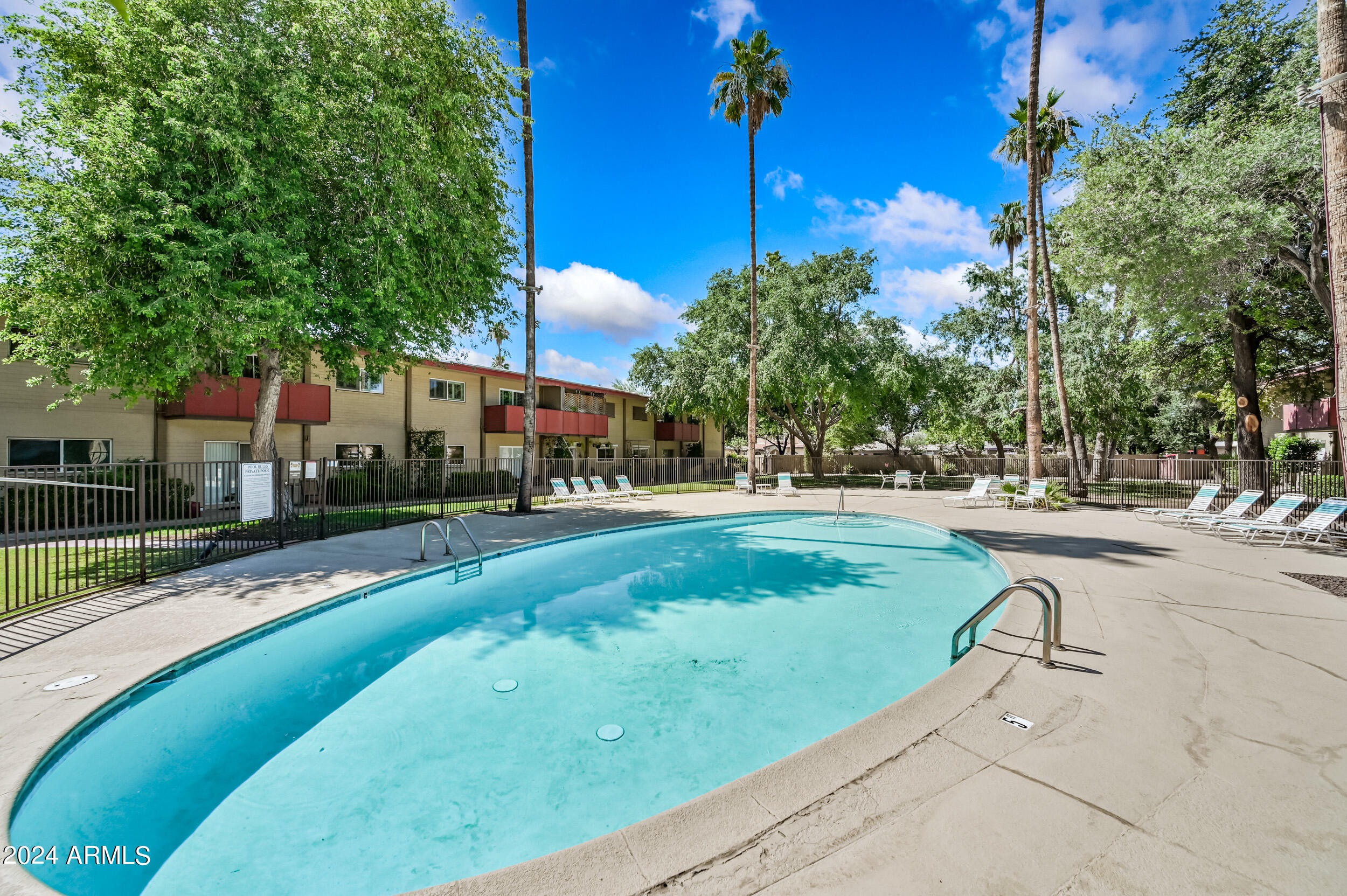 357 East Thomas Road, Unit A208 Phoenix, AZ 85012 - Photo 29 of 36 a view of a swimming pool with a patio
